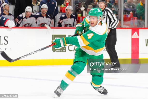 Jon Merrill of the Minnesota Wild shoots the puck against the Columbus Blue Jackets during the game at the Xcel Energy Center on October 21, 2023 in...