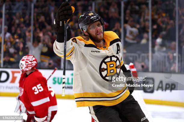 David Pastrnak of the Boston Bruins celebrates after scoring a penalty shot awarded after he was slashed by Jake Walman of the Detroit Red Wings...