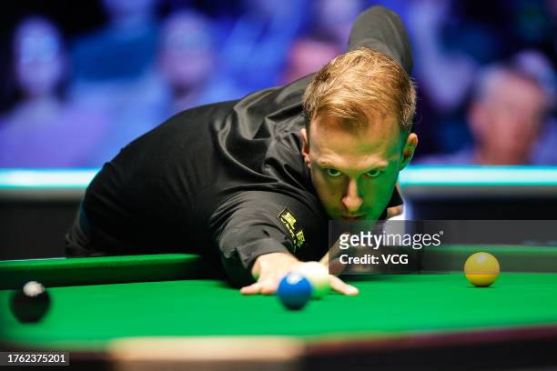 Judd Trump of England plays a shot in the Semi-final match against Barry Hawkins of England on day seven of 2023 Northern Ireland Open at Waterfront...