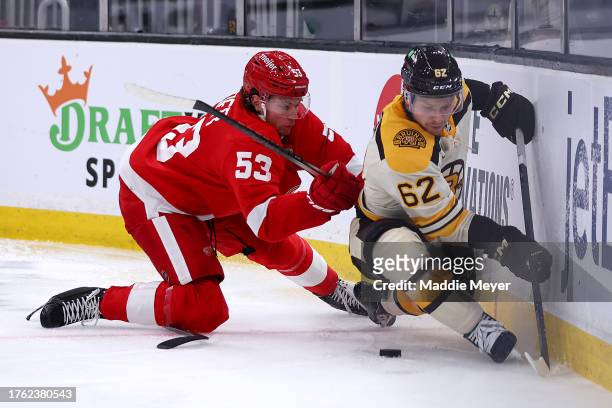 Moritz Seider of the Detroit Red Wings collides with Oskar Steen of the Boston Bruins during the third period at TD Garden on October 28, 2023 in...