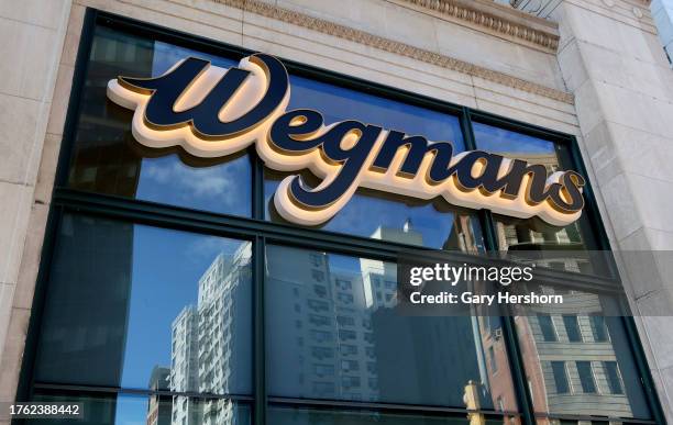 The Wegmans corporate logo hangs outside their Astor Place grocery store on October 28 in New York City.