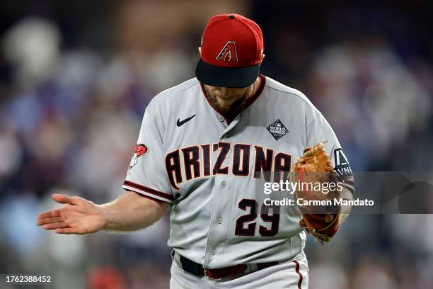 Merrill Kelly of the Arizona Diamondbacks walks off the field after the seventh inning against the Texas Rangers during Game Two of the World Series...