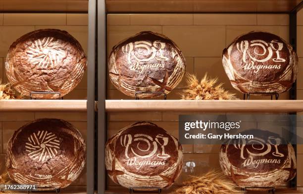 The Wegmans corporate logo is displayed on bread in their new Astor Place grocery store on October 28 in New York City.