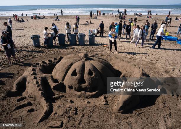 Architects and children build giant sand sculptures on a beach during the 41st Annual Sandcastle Classic on October 28, 2023 in San Francisco,...