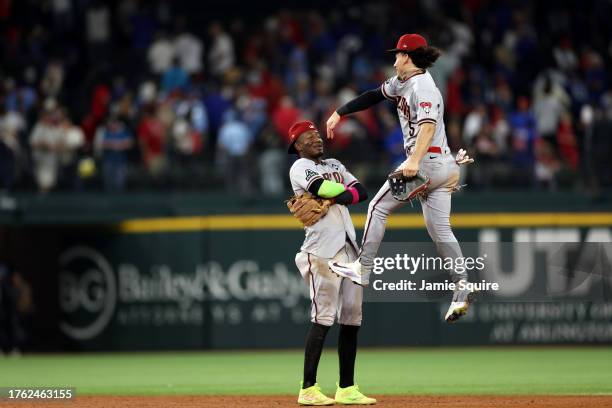 Geraldo Perdomo and Alek Thomas of the Arizona Diamondbacks celebrate after beating the Texas Rangers 9-1 in Game Two of the World Series at Globe...