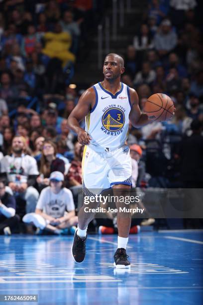 Chris Paul of the Golden State Warriors brings the ball up court against the Oklahoma City Thunder during the In-Season Tournament on November 3,...