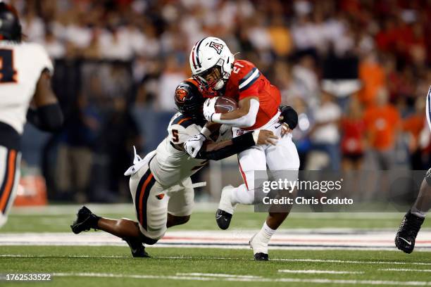 Linebacker Easton Mascarenas-Arnold of the Oregon State Beavers tackles running back Rayshon Luke of the Arizona Wildcats during the first half at...