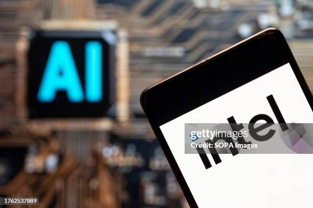 In this photo illustration, the American multinational corporation and microprocessor technology company, Intel logo seen displayed on a smartphone...