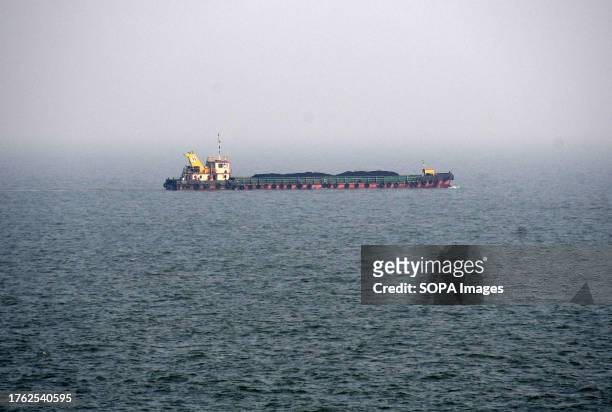 Ship carrying coal is seen moving on the water of Arabian sea in Mumbai.