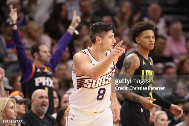 Grayson Allen of the Phoenix Suns reacts to a three-point shot against Keyonte George of the Utah Jazz during the second half of the NBA game at...