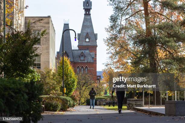 People walk through the Cornell University campus on November 3, 2023 in Ithaca, New York. The university canceled classes after one of its students...