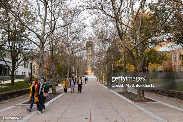 Cornell University students walk through campus on November 3, 2023 in Ithaca, New York. The university canceled classes after one of its students is...