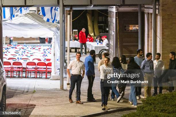 People enter the Center for Jewish Living at Cornell University where a Unity Shabbat dinner was held on November 3, 2023 in Ithaca, New York. The...