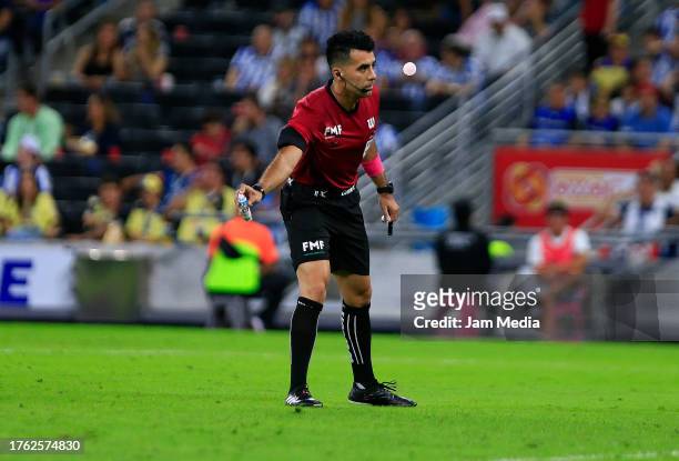 Adonai Escobedo, central referee, gestures during the 14th round match between Monterrey and America as part of the Torneo Apertura 2023 Liga MX at...
