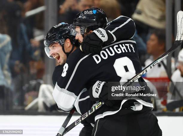 Kevin Fiala and Drew Doughty of the Los Angeles Kings celebrate a goal against the Vegas Golden Knights in the third period at Crypto.com Arena on...