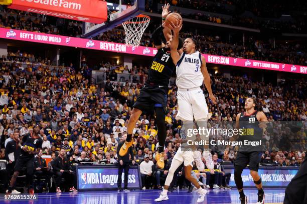 Jamal Murray of the Denver Nuggets goes to the basket against Grant Williams of the Dallas Mavericks during the NBA In-Season Tournament game at Ball...