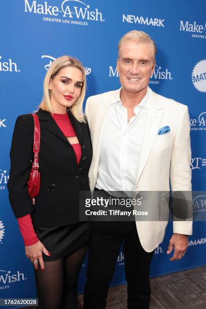 Emma Krokdal and Dolph Lundgren attend the Wish Gala 2023 at Fairmont Century Plaza on October 28, 2023 in Los Angeles, California.
