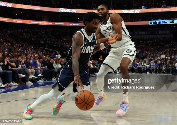 Kyrie Irving of the Dallas Mavericks drives the ball past Mikal Bridges of the Brooklyn Nets in a game at American Airlines Center on October 27,...