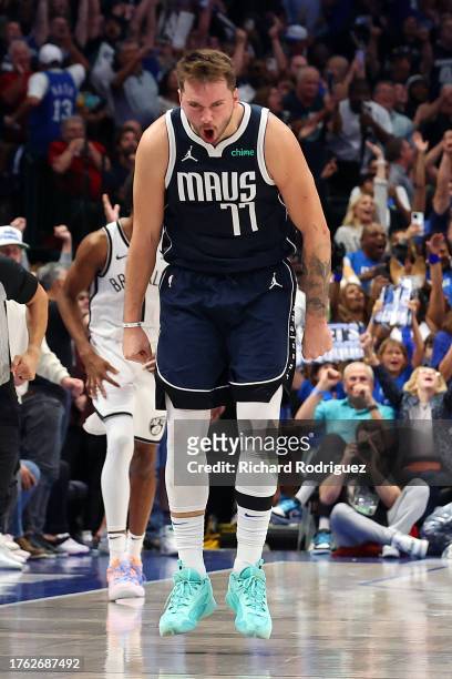 Luka Doncic of the Dallas Mavericks reacts after sinking a three-pointer in the fourth quarter against the Brooklyn Nets at American Airlines Center...