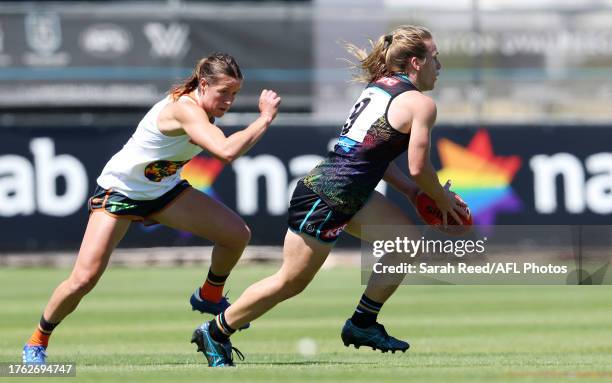 Maria Moloney of the Power and Nicola Barr of the Giants during the 2023 AFLW Round 10 match between The Port Adelaide Power and The GWS GIANTS at...