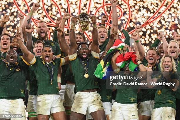 Siya Kolisi of South Africa lifts The Webb Ellis Cup following the Rugby World Cup Final match between New Zealand and South Africa at Stade de...