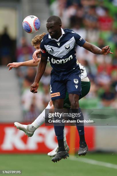 Jason Geria of the Victory competes in the air during the A-League Men round two match between Melbourne Victory and Newcastle Jets at AAMI Park on...