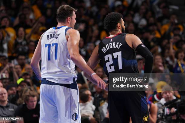 Luka Doncic of the Dallas Mavericks and Jamal Murray of the Denver Nuggets looks on during the game during the In-Season Tournament on November 3,...