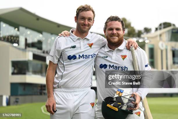 Jarrod Freeman and Brad Hope of the Tigers pose for a photo after the win during the Sheffield Shield match between Tasmania and Queensland at...