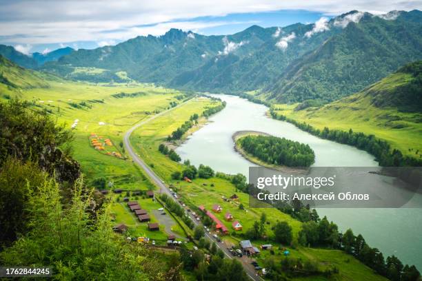 view of the katun river in the altai. mountain valley che-chkysh. summer landscape. turquoise river, mountains and green meadows - verdigris river bildbanksfoton och bilder