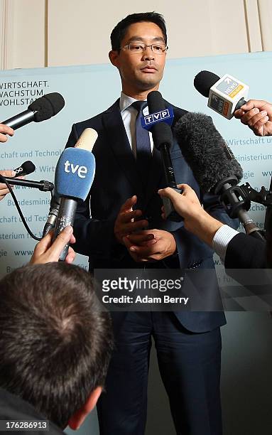German Economy Minister Philipp Roesler speaks with foreign journalists on August 12, 2013 in the federal economy ministry in Berlin, Germany....