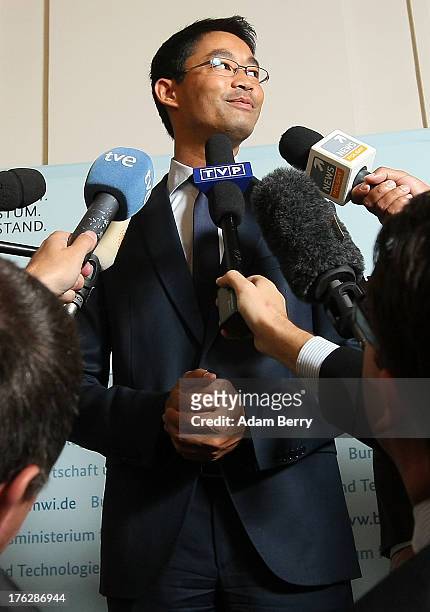 German Economy Minister Philipp Roesler speaks with foreign journalists on August 12, 2013 in the federal economy ministry in Berlin, Germany....