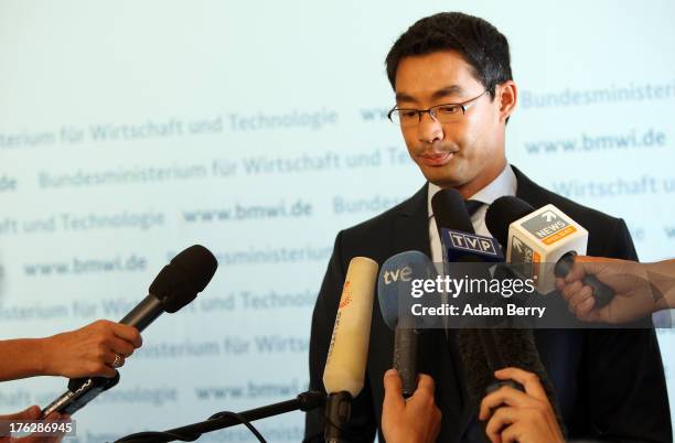 German Economy Minister Philipp Roesler speaks with foreign journalists on August 12, 2013 in the federal economy ministry in Berlin, Germany....