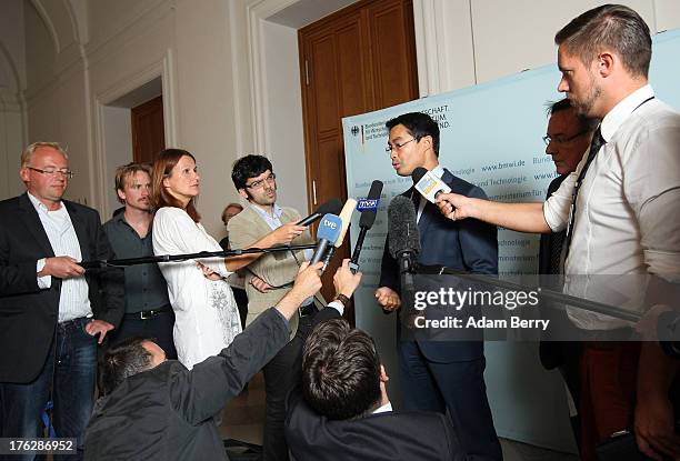 German Economy Minister Philipp Roesler speaks with foreign journalists on August 12, 2013 in the federal economy ministry in Berlin, Germany....