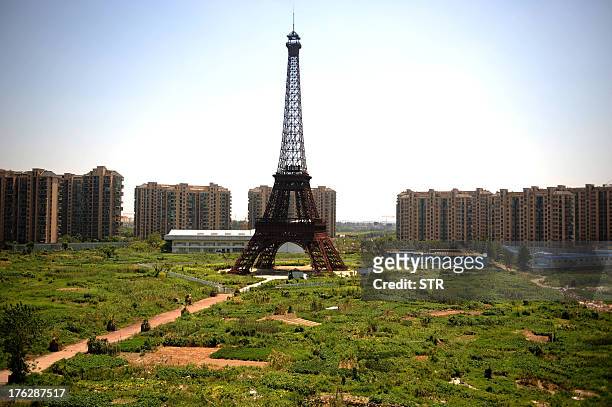 This picture taken on August 7, 2013 shows a replica of the Effel Tower in Tianducheng, a luxury real estate development located in Hangzhou, east...