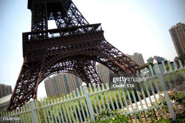 This picture taken on August 7, 2013 shows a replica of the Effel Tower in Tianducheng, a luxury real estate development located in Hangzhou, east...