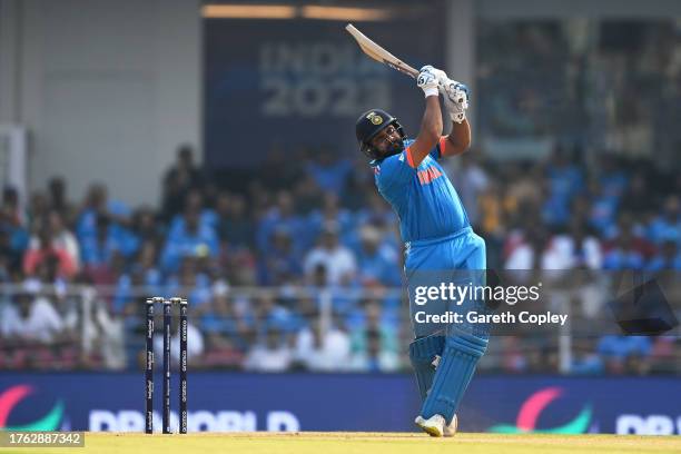 Rohit Sharma of India plays a shot for six during the ICC Men's Cricket World Cup India 2023 between India and England at BRSABVE Cricket Stadium on...