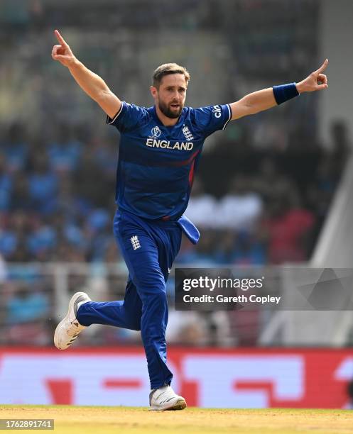 Chris Woakes of England celebrates the wicket of Shubman Gill of India during the ICC Men's Cricket World Cup India 2023 between India and England at...