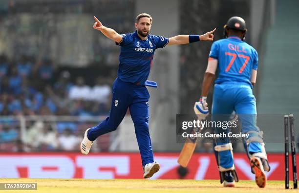 Chris Woakes of England celebrates the wicket of Shubman Gill of India during the ICC Men's Cricket World Cup India 2023 between India and England at...