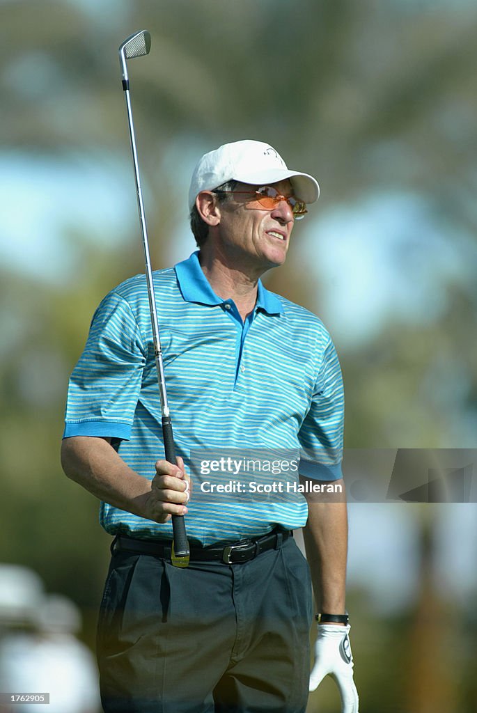 Maury Povich watches a shot