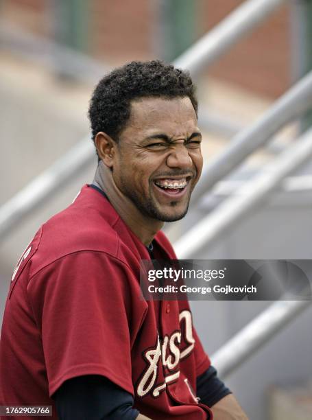 Willy Taveras of the Houston Astros smiles as he looks on from the dugout before the first game of a doubleheader against the Pittsburgh Pirates at...