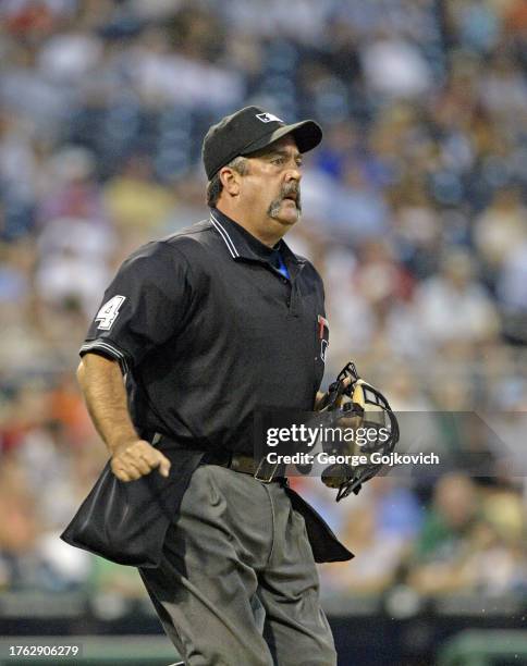 Major League Baseball umpire Tim Tschida looks on from the field during the second game of a doubleheader between the Houston Astros and Pittsburgh...