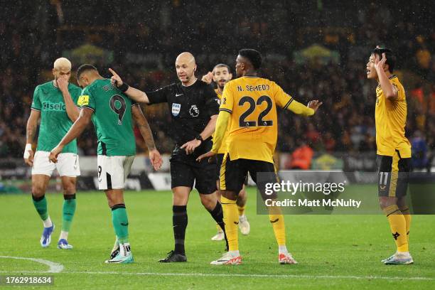 Referee Anthony Taylor awards Newcastle United a penalty kick during the Premier League match between Wolverhampton Wanderers and Newcastle United at...