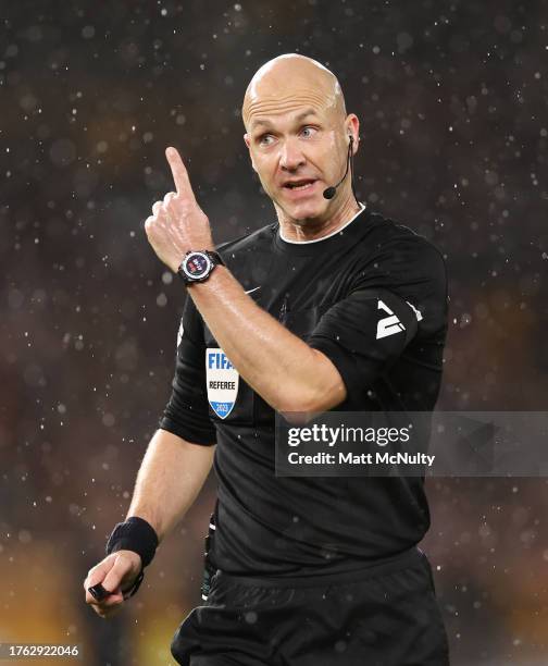 Referee Anthony Taylor gestures during the Premier League match between Wolverhampton Wanderers and Newcastle United at Molineux on October 28, 2023...