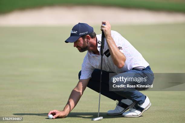 Scott Jamieson of Scotland lines up a putt on the fourth hole during Day Four of the Commercial Bank Qatar Masters at Doha Golf Club on October 29,...