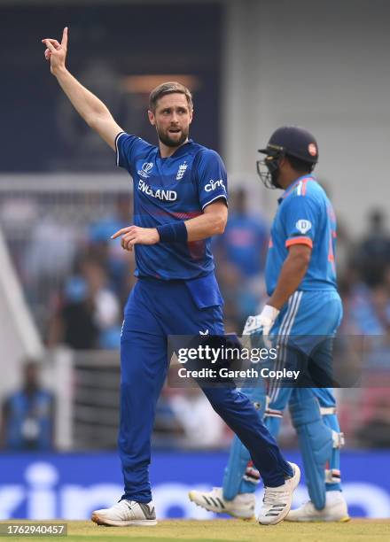 Chris Woakes of England celebrates the wicket of Shreyas Iyer of India during the ICC Men's Cricket World Cup India 2023 between India and England at...