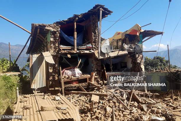 Damaged houses lie in ruins, in the aftermath of an earthquake at Pipaldanda village of Jajarkot district on November 4, 2023. At least 132 people...