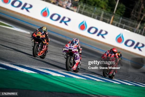 Jorge Martin of Spain and Prima Pramac Racing rides in front of Brad Binder of South Africa and Red Bull KTM Factory Racing and Francesco Bagnaia of...