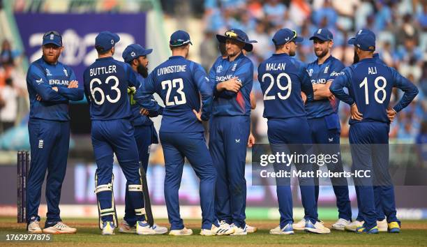 Players of England look on during a review during the ICC Men's Cricket World Cup India 2023 between India and England at BRSABVE Cricket Stadium on...