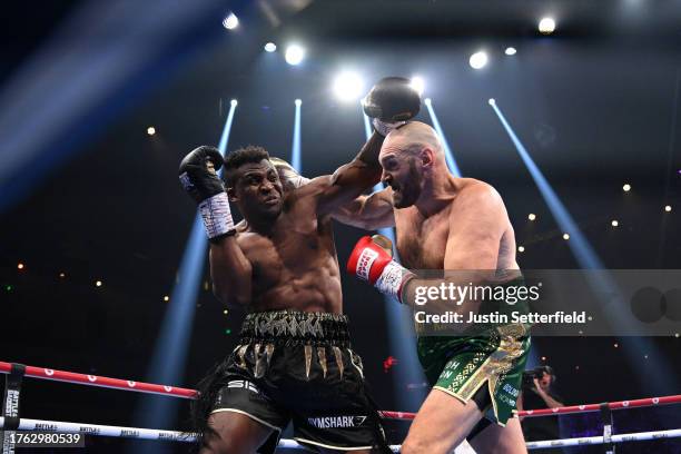 Francis Ngannou punches Tyson Fury during the Heavyweight fight between Tyson Fury and Francis Ngannou at Boulevard Hall on October 28, 2023 in...