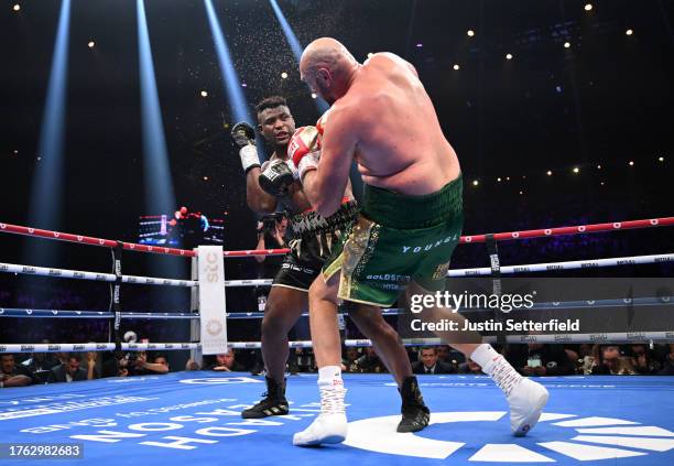 Francis Ngannou knocks down Tyson Fury during the Heavyweight fight between Tyson Fury and Francis Ngannou at Boulevard Hall on October 28, 2023 in...